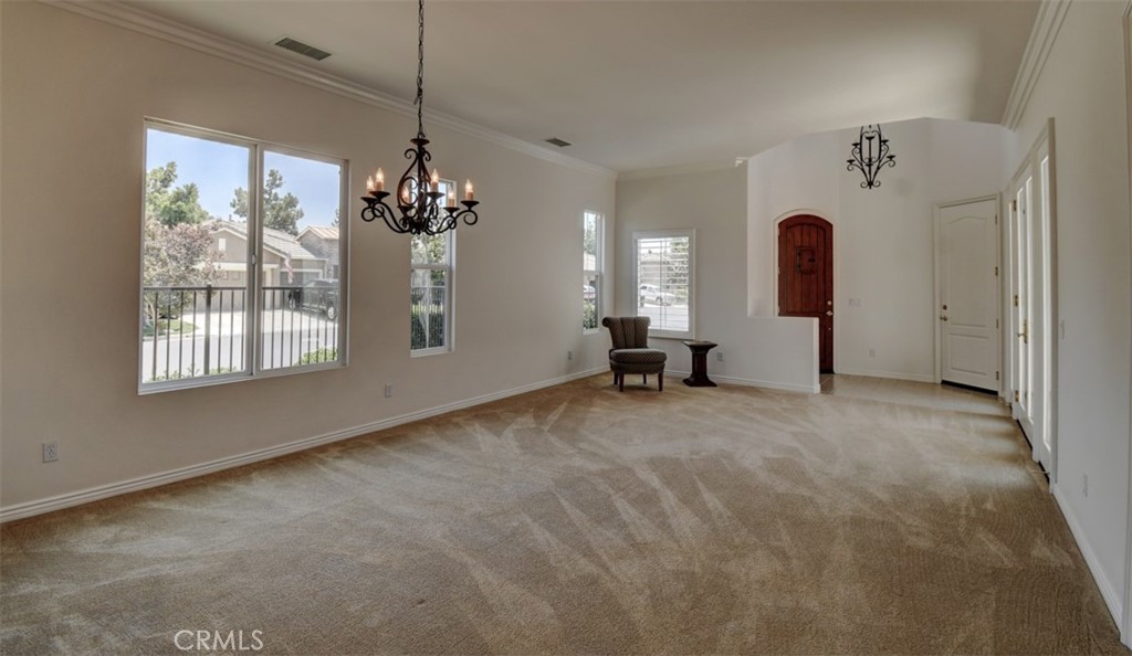 9152 Deergrass Street Corona, CA 92883 - Photo 6 of 32 a view of a chandelier and window in a room