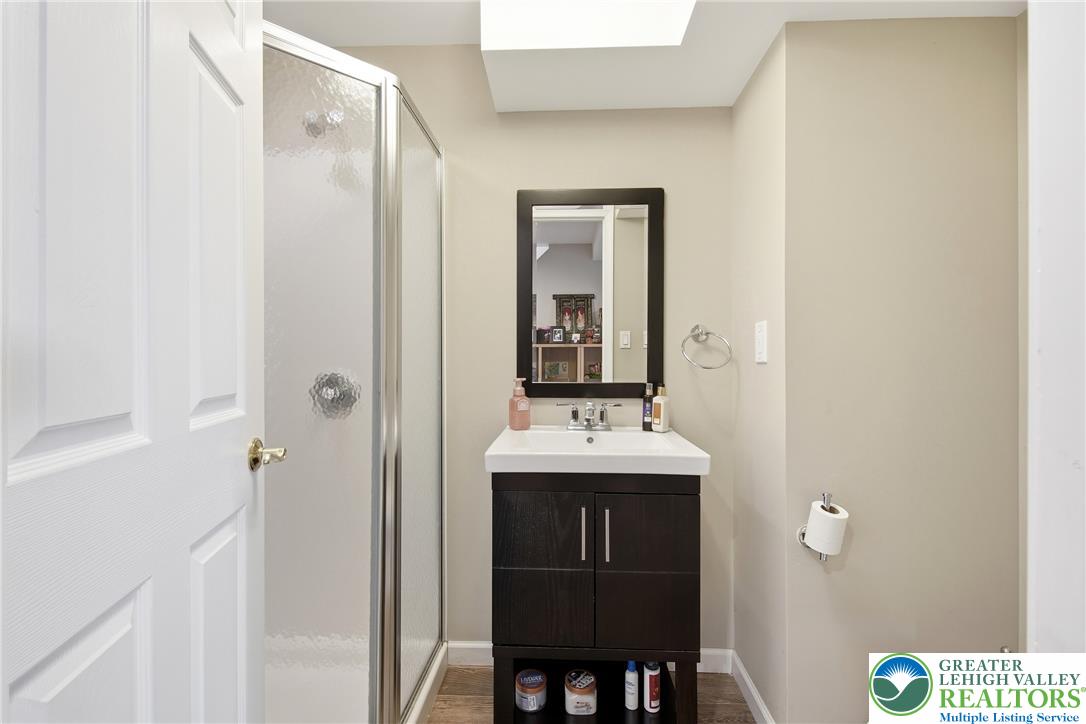 115 West Butternut Road Hellertown, PA 18055 - Photo 61 of 97 A well-appointed bathroom with a modern vanity and a functional stand-up shower stall.
