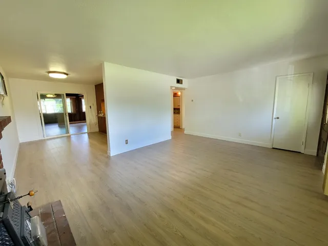 a view of a livingroom with wooden floor