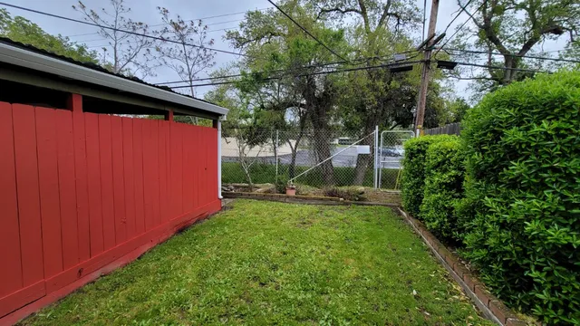 a view of a backyard with a small cabin