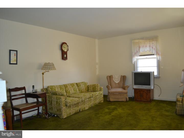 27 Golf Road Darby, PA 19023 - Photo 2 of 12 a living room with furniture and a flat screen tv