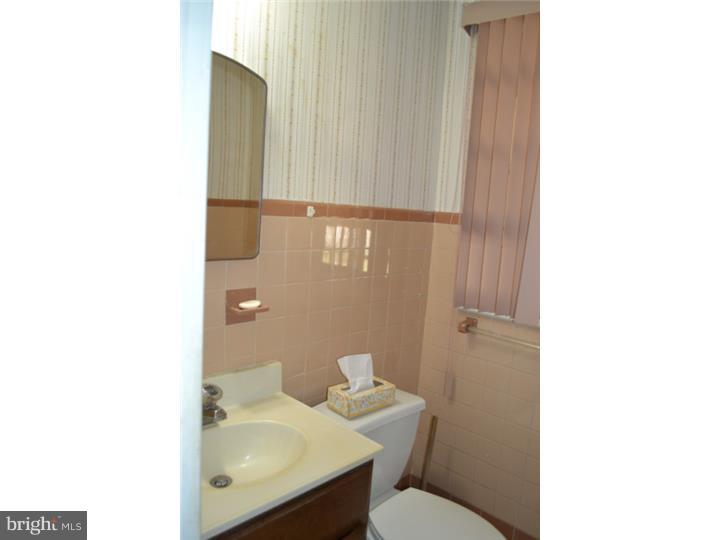 27 Golf Road Darby, PA 19023 - Photo 7 of 12 a bathroom with a sink and a toilet