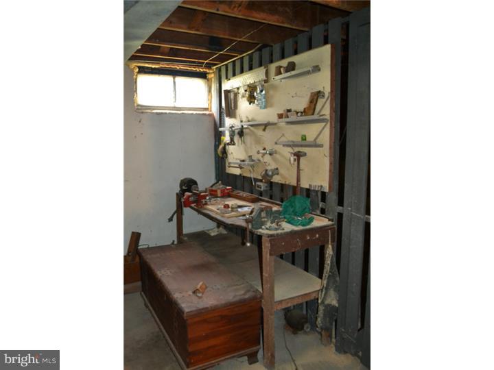 27 Golf Road Darby, PA 19023 - Photo 9 of 12 a view of a room that has a table and chairs in it