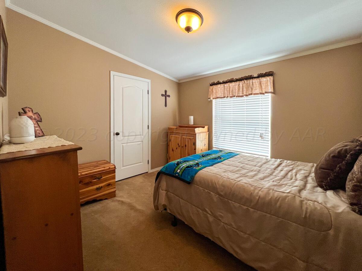 7670 West Cemetery Road Canyon, TX 79015 - Photo 32 of 65 7670_W_Cemetery-056_Main_House_Bedroom