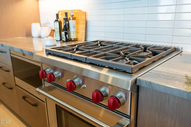 a view of dining room with furniture and a potted plant