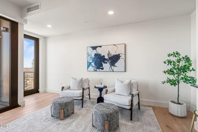 a living room with furniture and a table