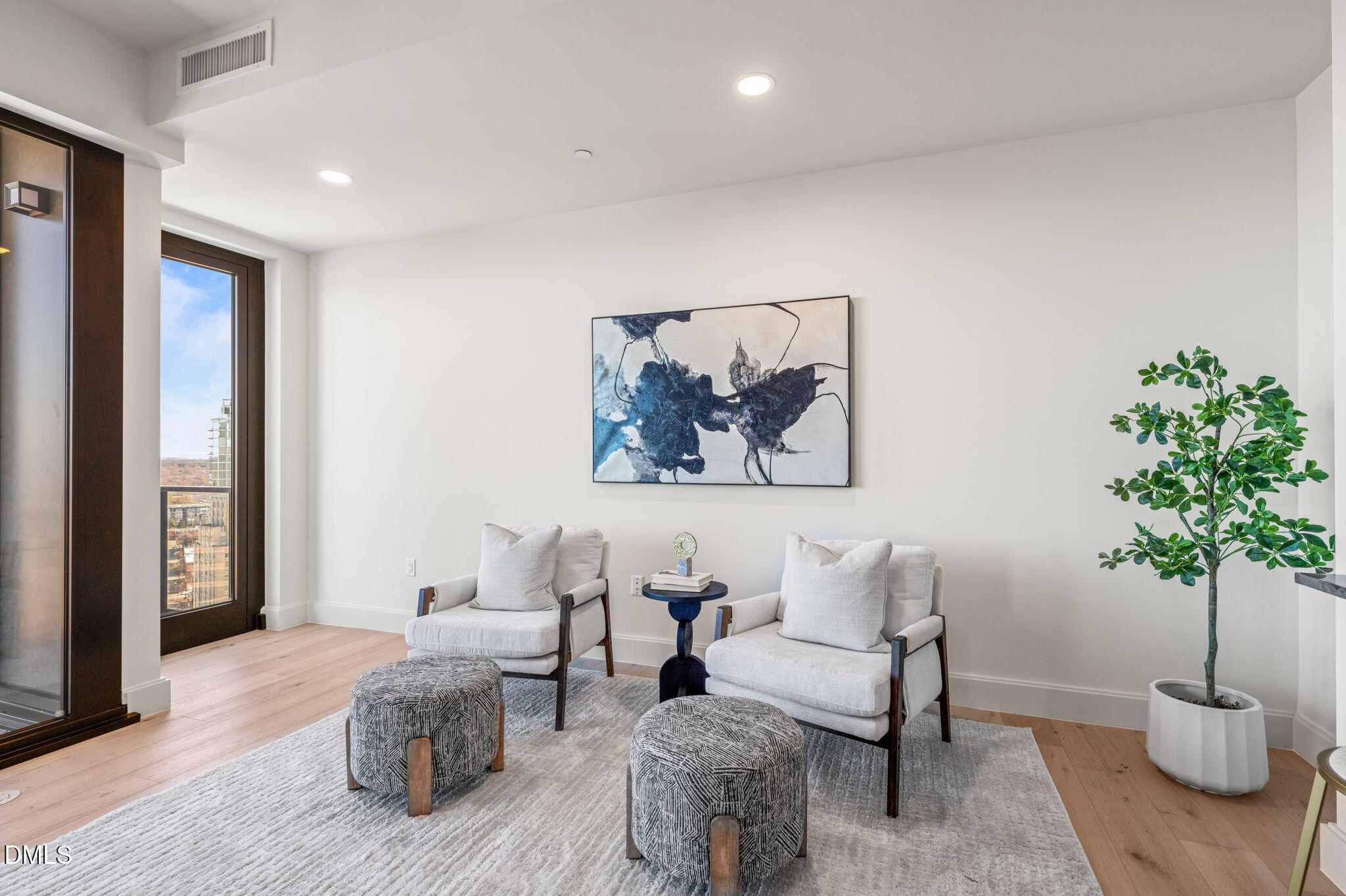 115 Morris Street, Unit 2601 Durham, NC 27701 - Photo 20 of 71 a living room with furniture and a potted plant