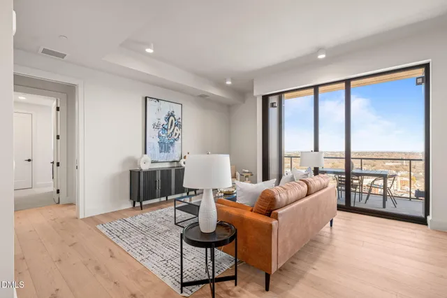 a bedroom with a large bed and a large window