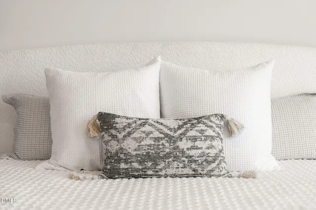 a bedroom with a bed and a view of bathroom