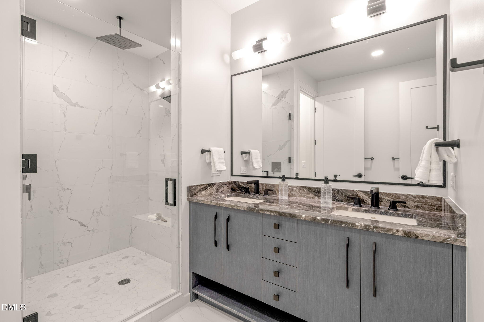115 Morris Street, Unit 2601 Durham, NC 27701 - Photo 36 of 71 a bathroom with a granite countertop sink mirror and shower