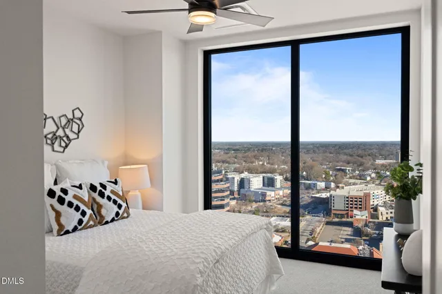a view of roof deck with two chairs and wooden floor