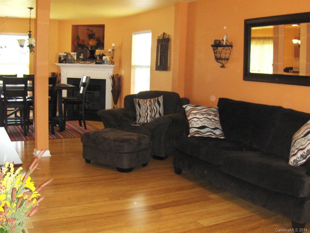 921 River Trail Road Lowell, NC 28098 - Photo 2 of 23 a living room with furniture and a fireplace
