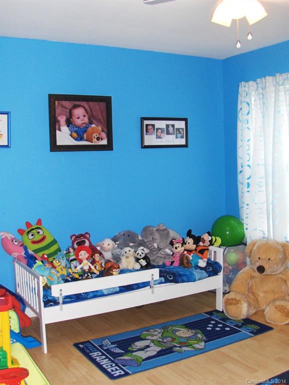 921 River Trail Road Lowell, NC 28098 - Photo 11 of 23 a room with toys and wooden floor