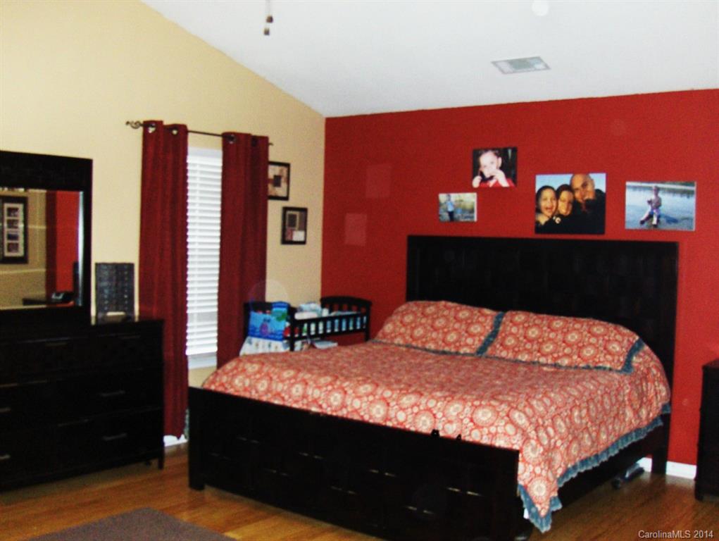 921 River Trail Road Lowell, NC 28098 - Photo 13 of 23 a bedroom with a bed and dresser