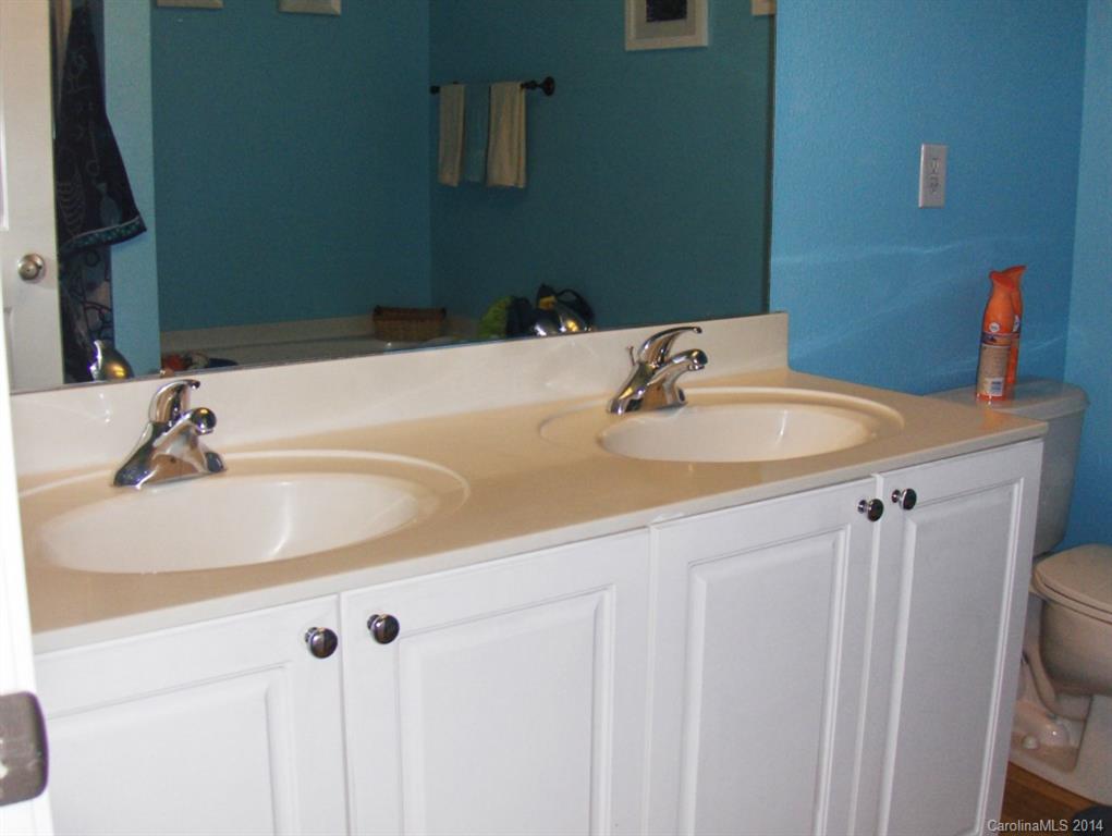 921 River Trail Road Lowell, NC 28098 - Photo 17 of 23 a bathroom with a sink and a mirror