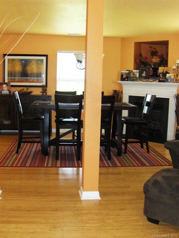 921 River Trail Road Lowell, NC 28098 - Photo 3 of 23 a view of a livingroom with furniture flat screen tv and outdoor view