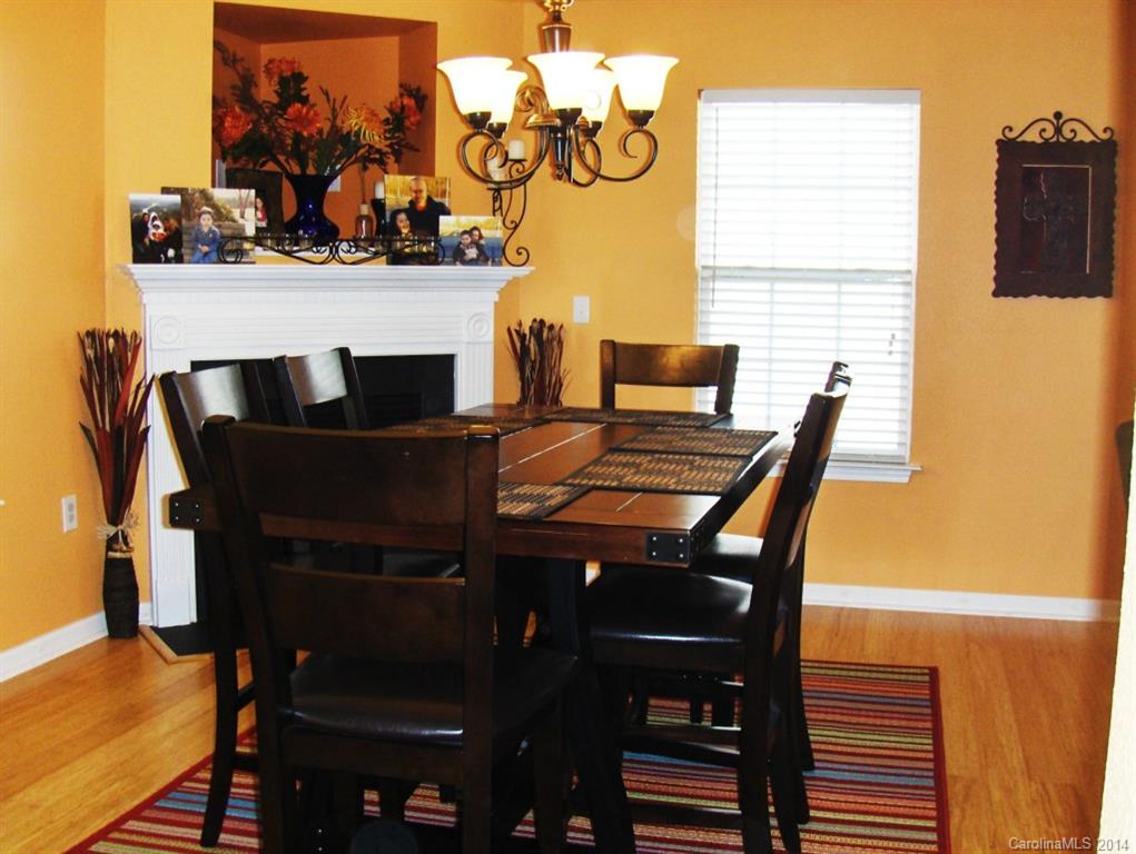 921 River Trail Road Lowell, NC 28098 - Photo 5 of 23 a view of a dining room with furniture and wooden floor