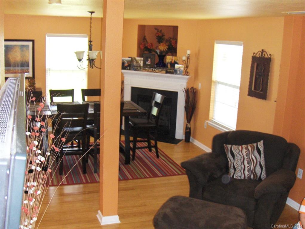 921 River Trail Road Lowell, NC 28098 - Photo 9 of 23 a living room with furniture a rug and a fireplace