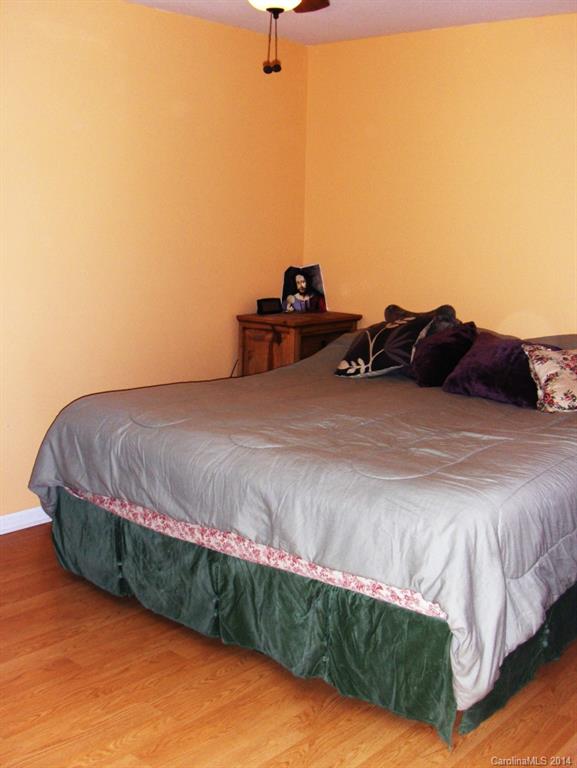 921 River Trail Road Lowell, NC 28098 - Photo 10 of 23 a bed sitting in a bedroom next to a window