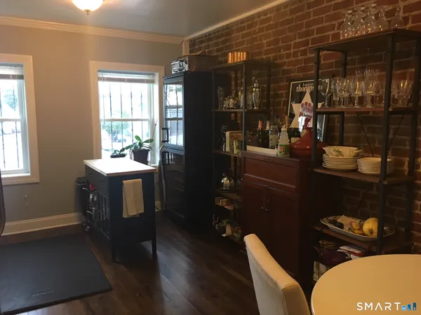 a bathroom with a sink a toilet and window