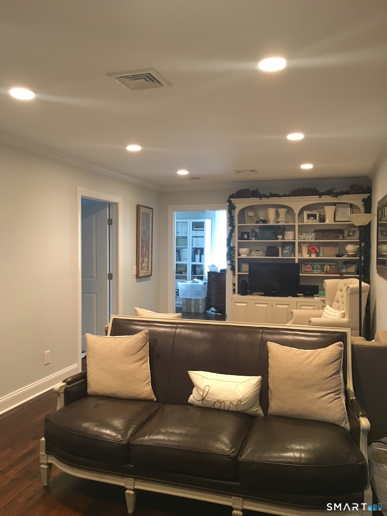69 Main Street Norwalk, CT 06851 - Photo 2 of 7 a living room with furniture and a large window