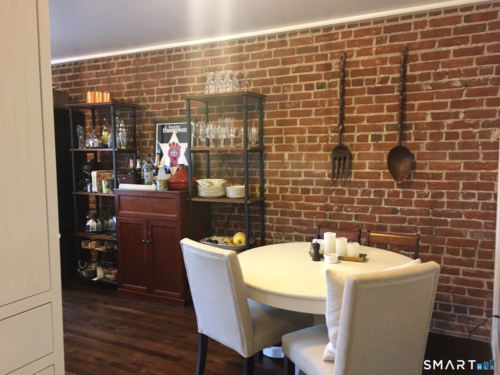 69 Main Street Norwalk, CT 06851 - Photo 3 of 7 a bathroom with a sink a mirror and a shower