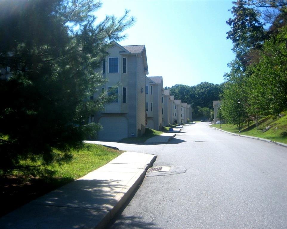 a view of a street with a house