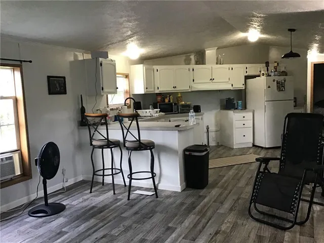 a view of kitchen with dining table and chairs