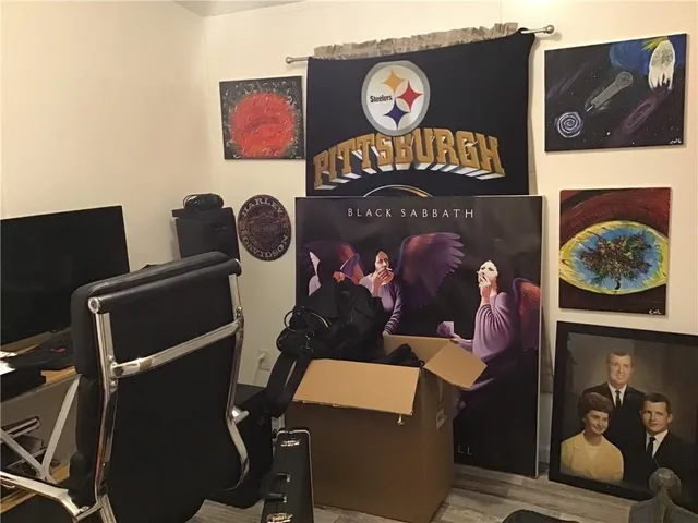 a group of people sitting on a bed