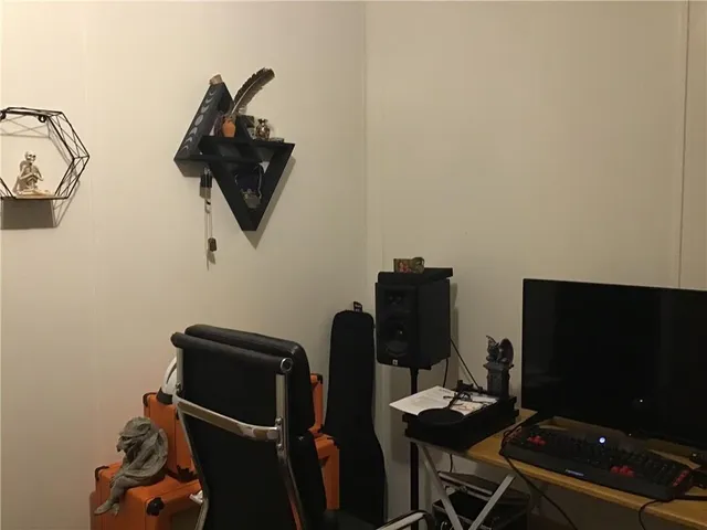 a view of workspace with wooden floor and gym equipment