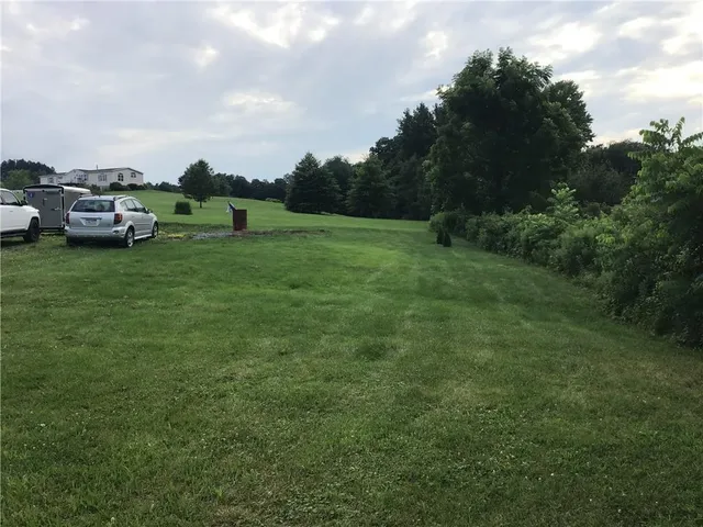 a car parked in the middle of a field