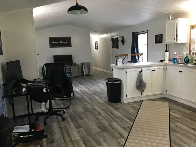 a view of kitchen with cabinets