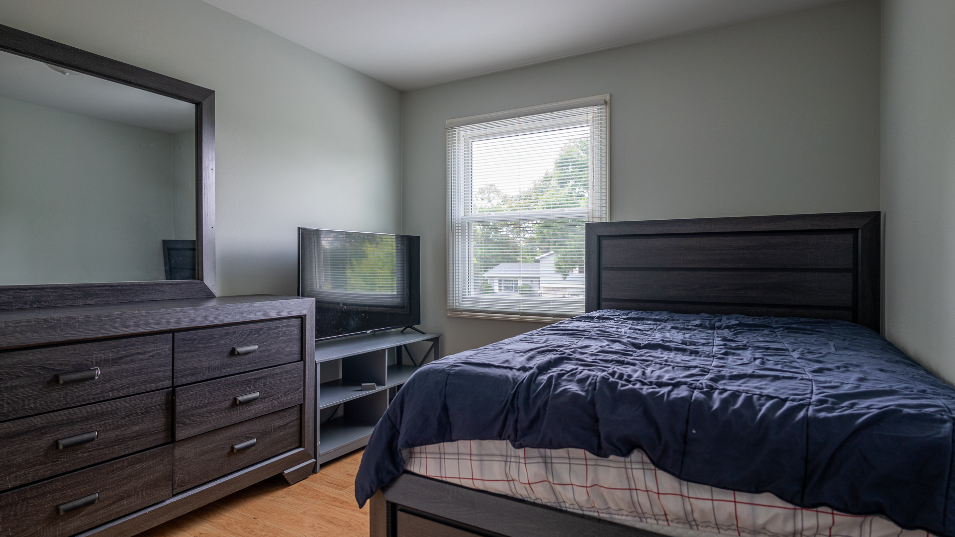 829 Prairie Avenue Bartlett, IL 60103 - Photo 11 of 25 a bedroom with a bed and flat screen tv