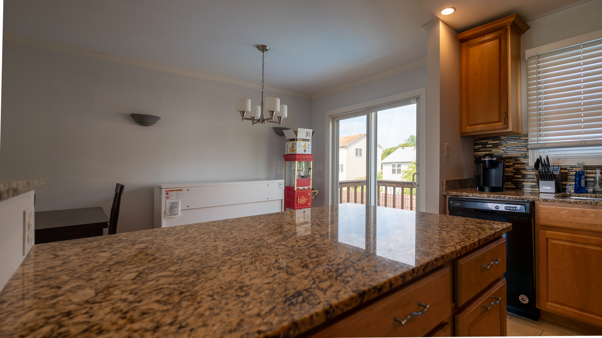 829 Prairie Avenue Bartlett, IL 60103 - Photo 16 of 25 a kitchen with stainless steel appliances granite countertop a sink a stove and a wooden floors