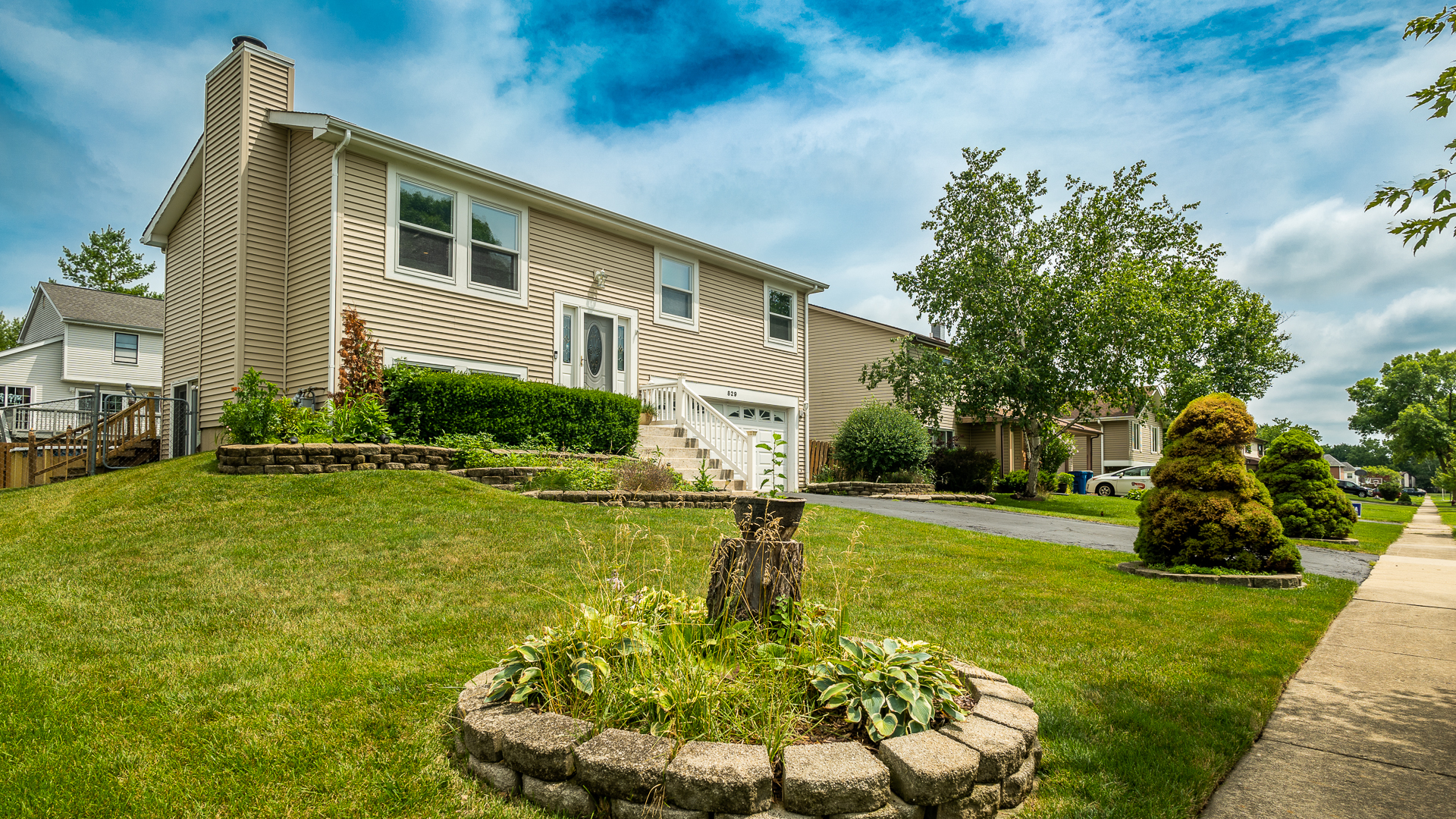 829 Prairie Avenue Bartlett, IL 60103 - Photo 5 of 25 a front view of a house with a yard