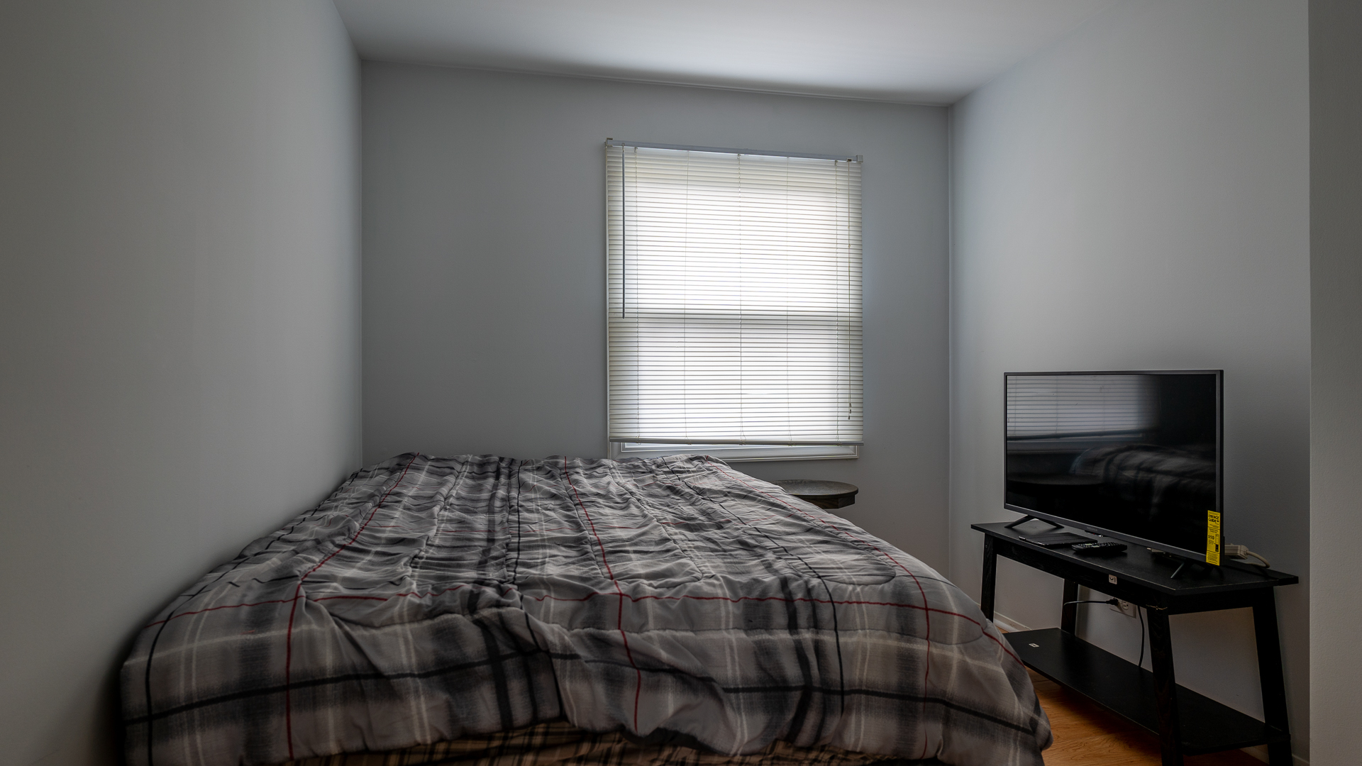 829 Prairie Avenue Bartlett, IL 60103 - Photo 10 of 25 a bedroom with a bed a television and a window