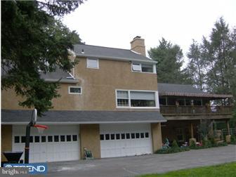 157 Ridgefield Road Newtown Square, PA 19073 - Photo 12 of 12 a front view of a house with a garden