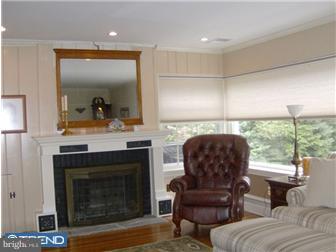157 Ridgefield Road Newtown Square, PA 19073 - Photo 3 of 12 a living room with furniture and a fireplace