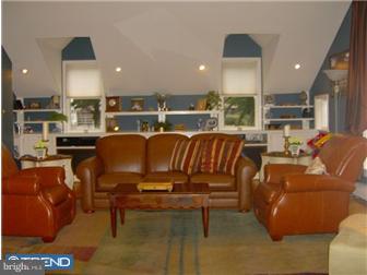 157 Ridgefield Road Newtown Square, PA 19073 - Photo 7 of 12 a living room with furniture a rug and kitchen view