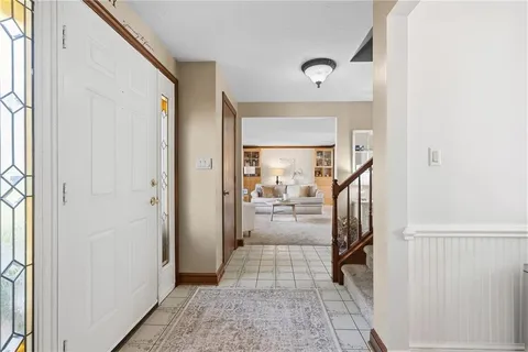 a view of an entryway with wooden floor