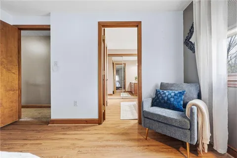 a bathroom with double vanity sinks a vanity a lamp and a mirror