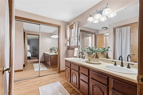 a white toilet sitting next to a shower curtain