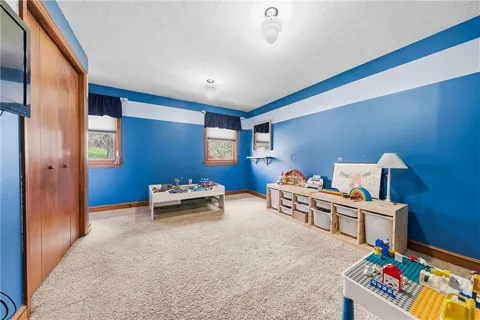 a bedroom with bed and a bookshelf