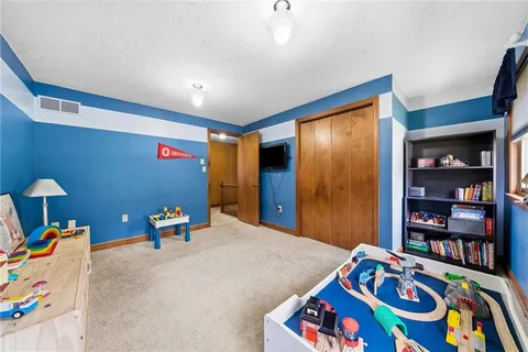 a bathroom with a granite countertop sink a mirror and a window