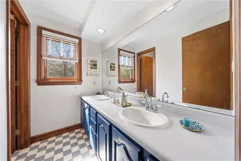 a white toilet sitting next to a white sink