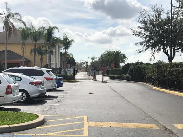 a street view with couple of cars parked on road