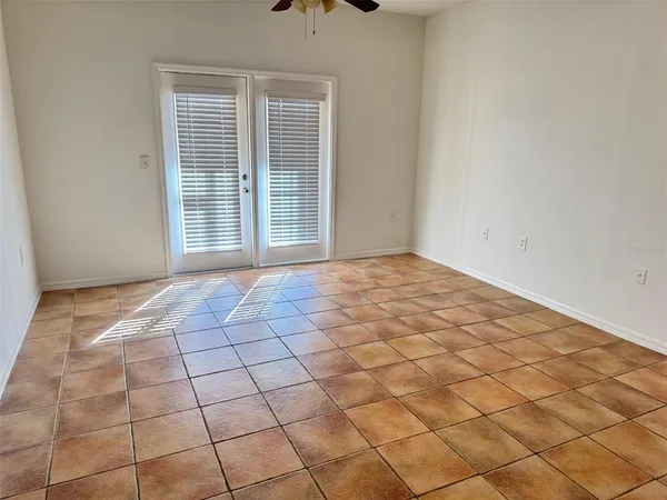 a view of an empty room and a window