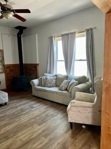 a view of a room with wooden floor and cabinet