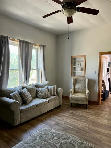 a living room with couch and a window