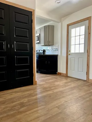 a kitchen with stainless steel appliances granite countertop a sink counter space and cabinets